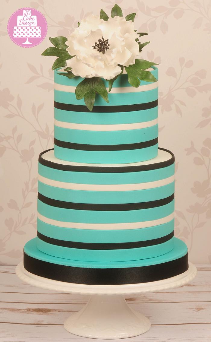 Striped cake with a white peony