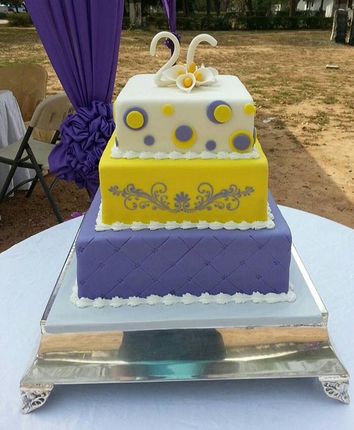 Purple and yellow wedding cake