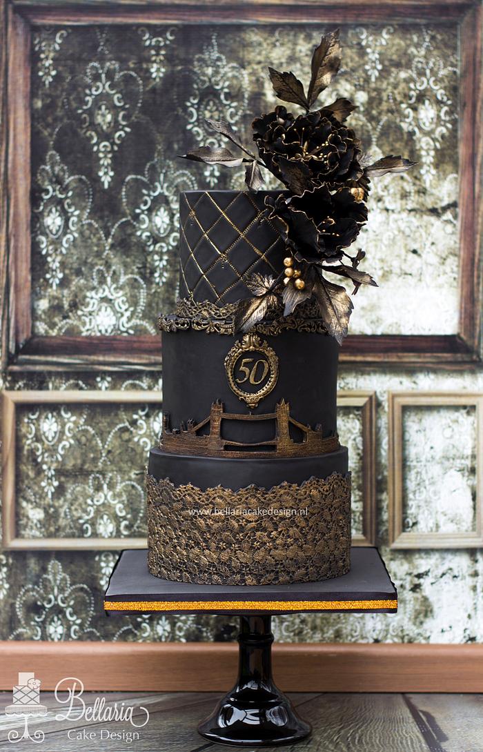 Black and bronze London themed birthday cake