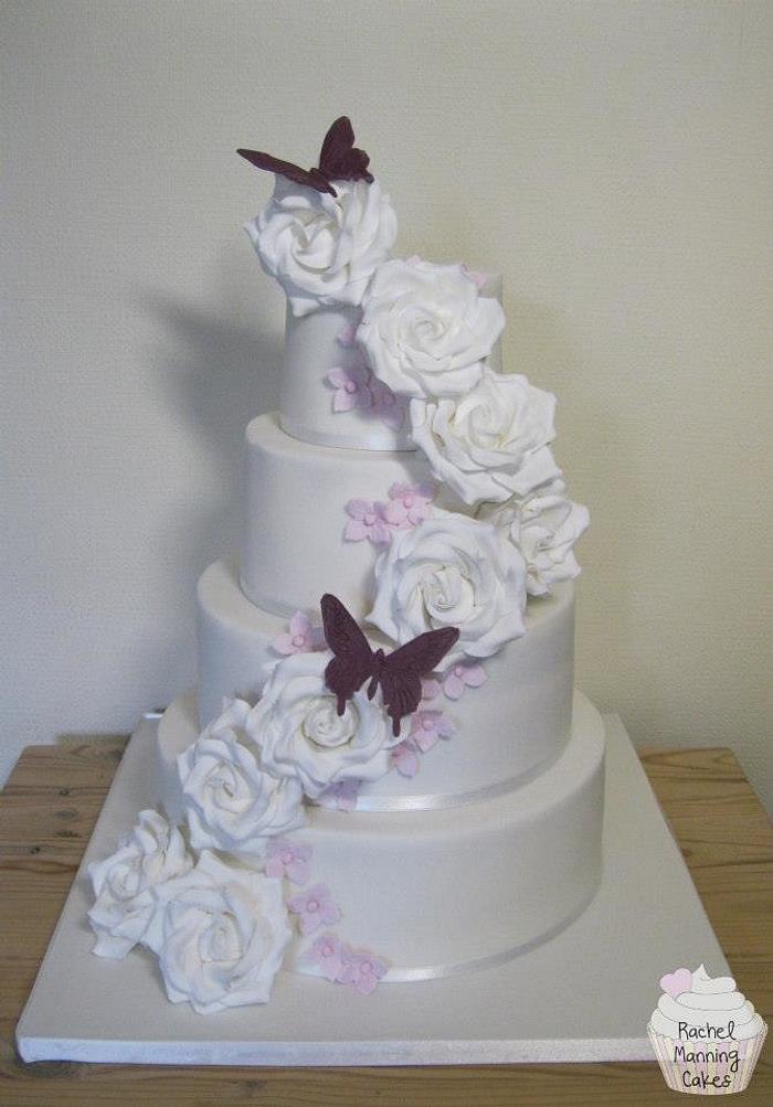 White roses and butterflies wedding cake