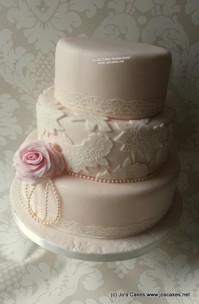 Three tier lace wedding cake