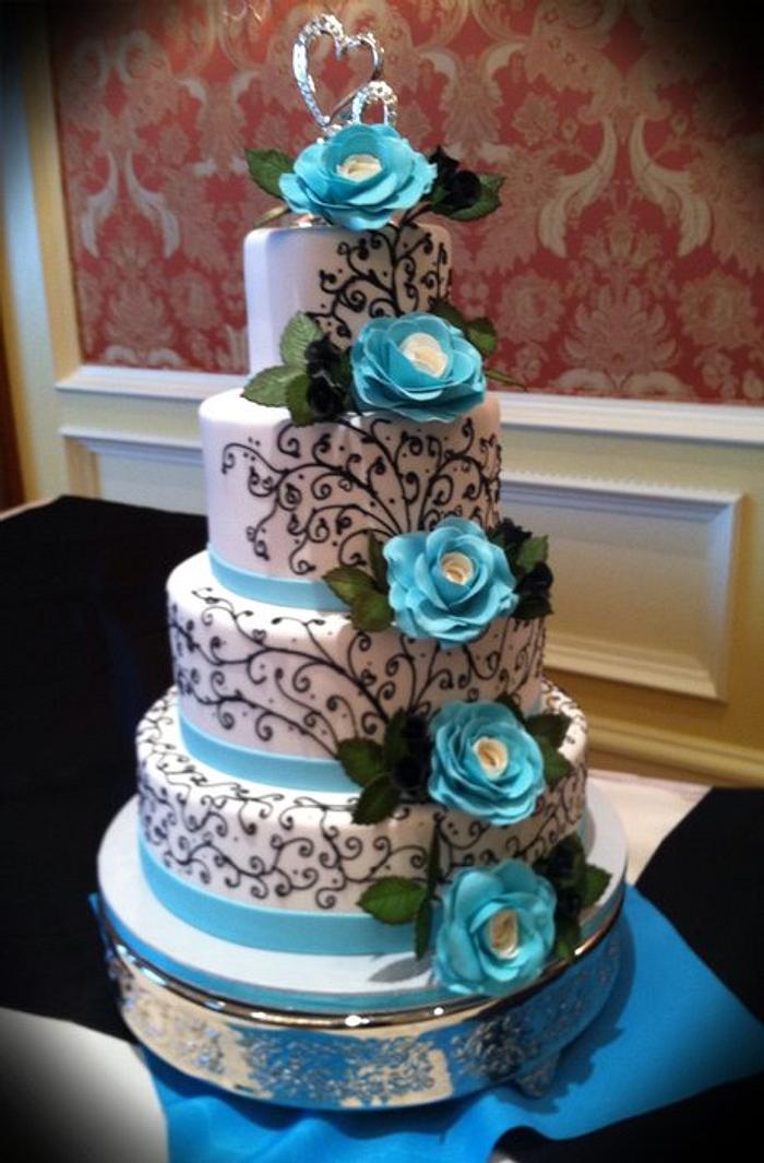Black scrolling wedding cake