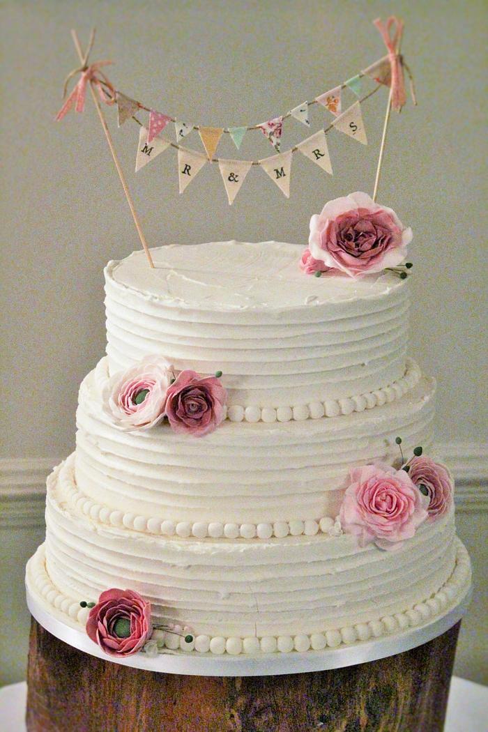 Rustic wedding cake with handmade bunting.