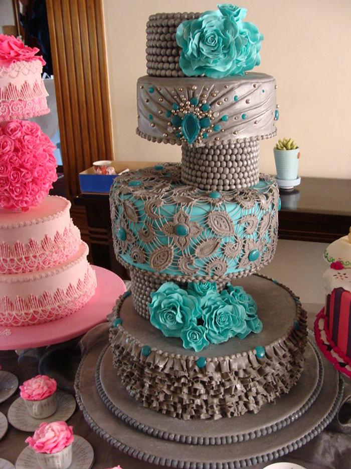 Grey wedding cake with ruffles and lace