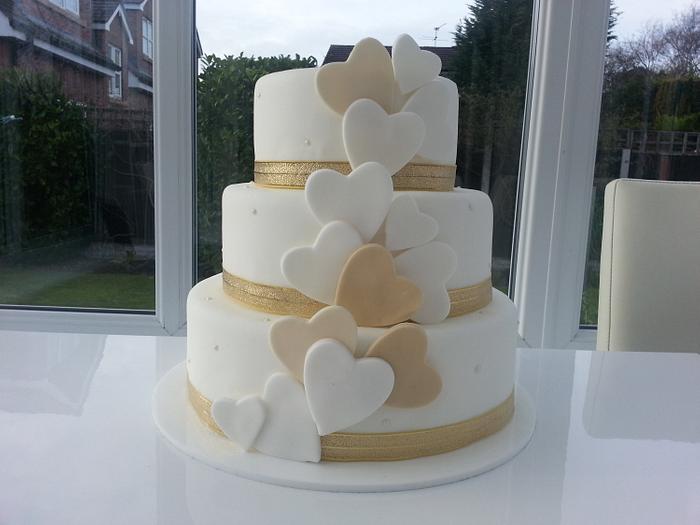 White and gold hearts wedding cake