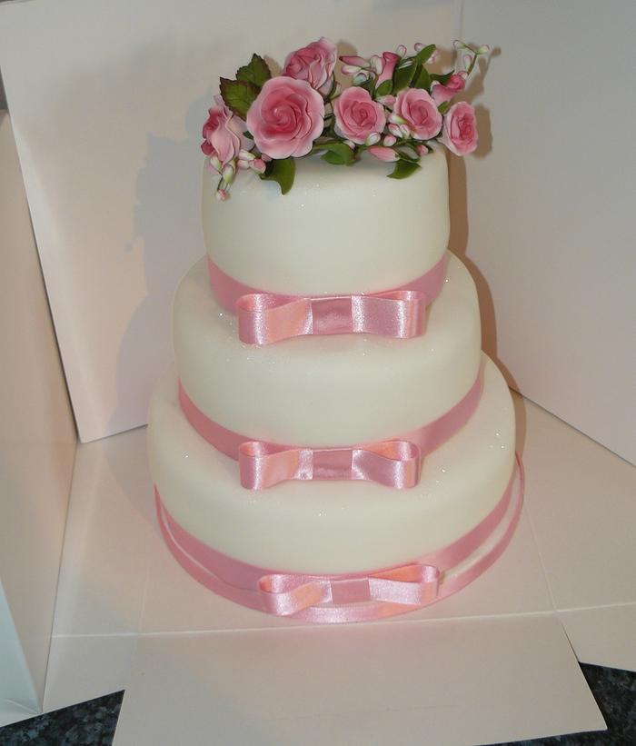 Pink and white basic wedding cake  