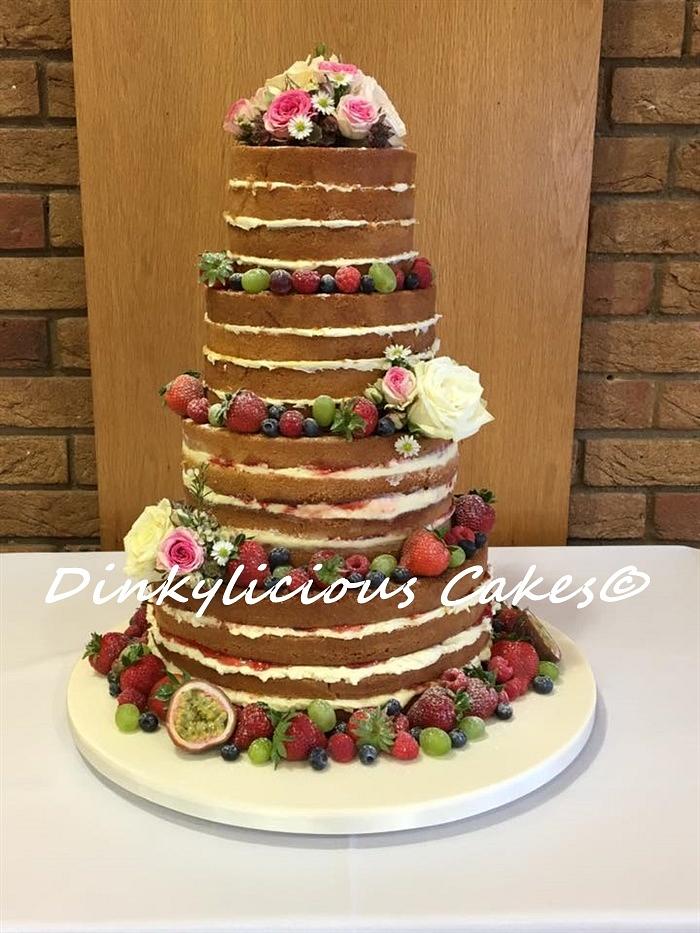 Naked wedding cake with seasonal berries