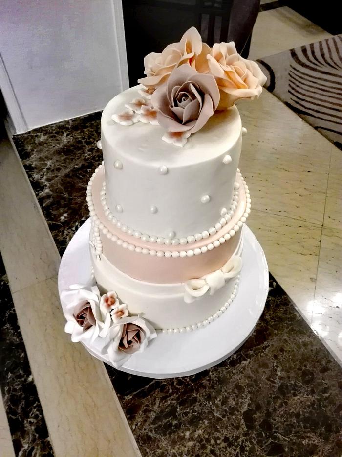 Ivory and coral engagement cake