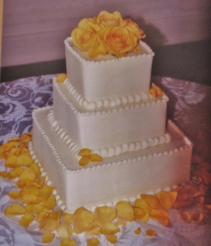 Square buttercream yellow rose wedding cake