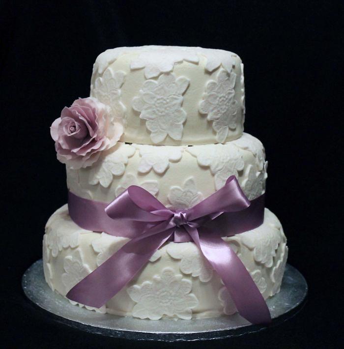 Wedding cake with purple rose
