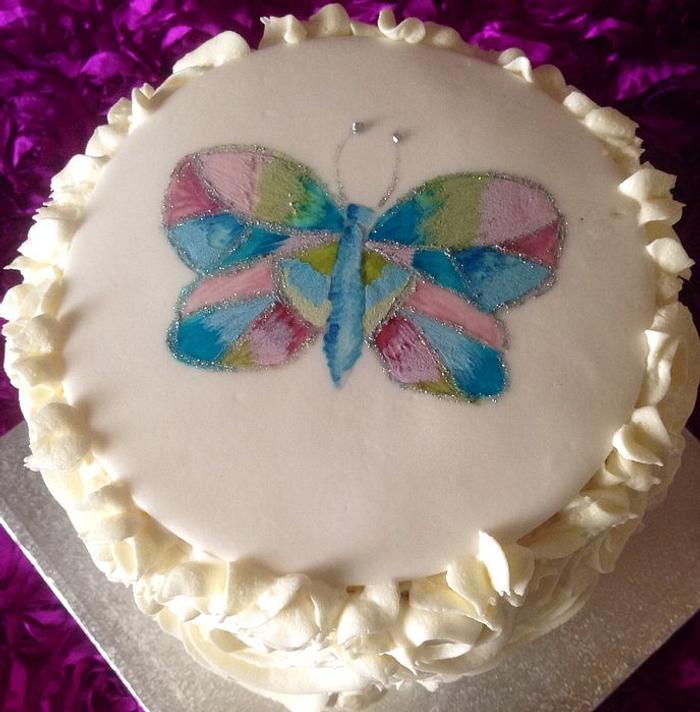 Hand painted butterfly rainbow birthday cake