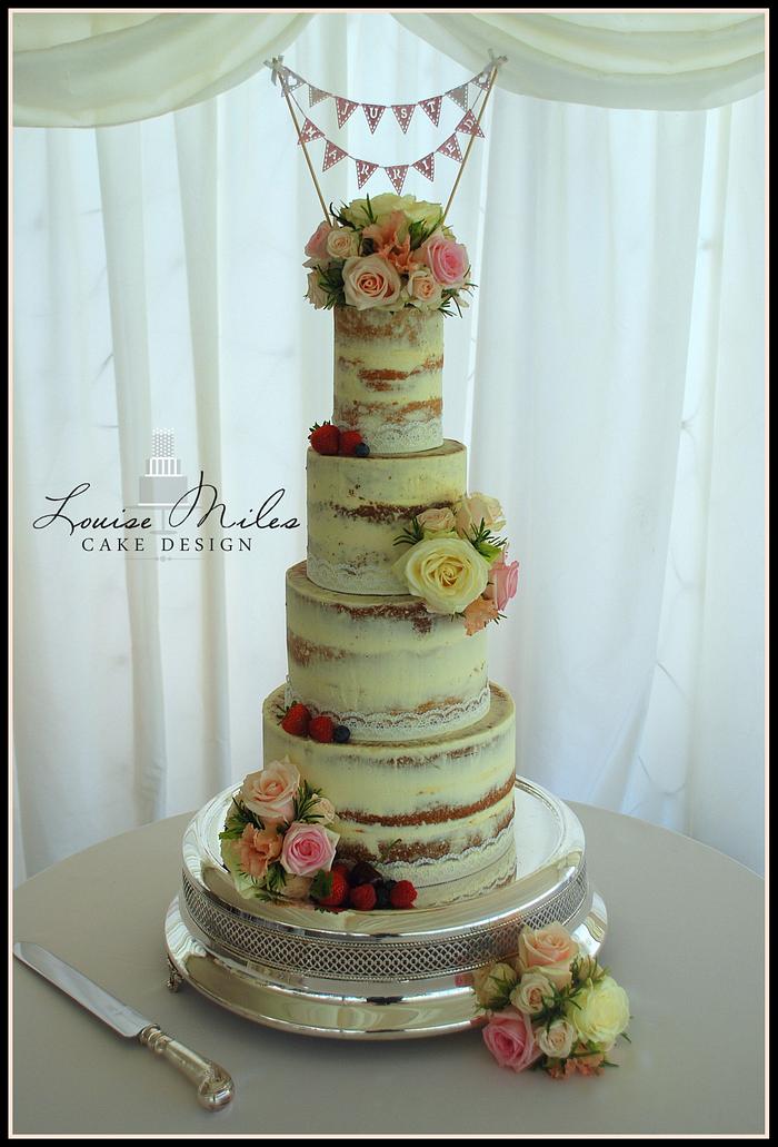 Semi naked wedding cake with fresh flowers