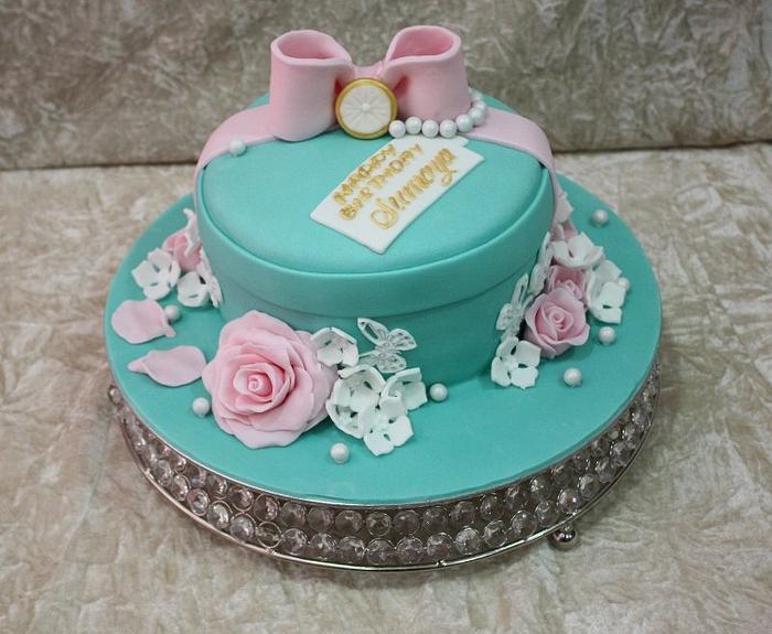 Light blue cake with pink roses