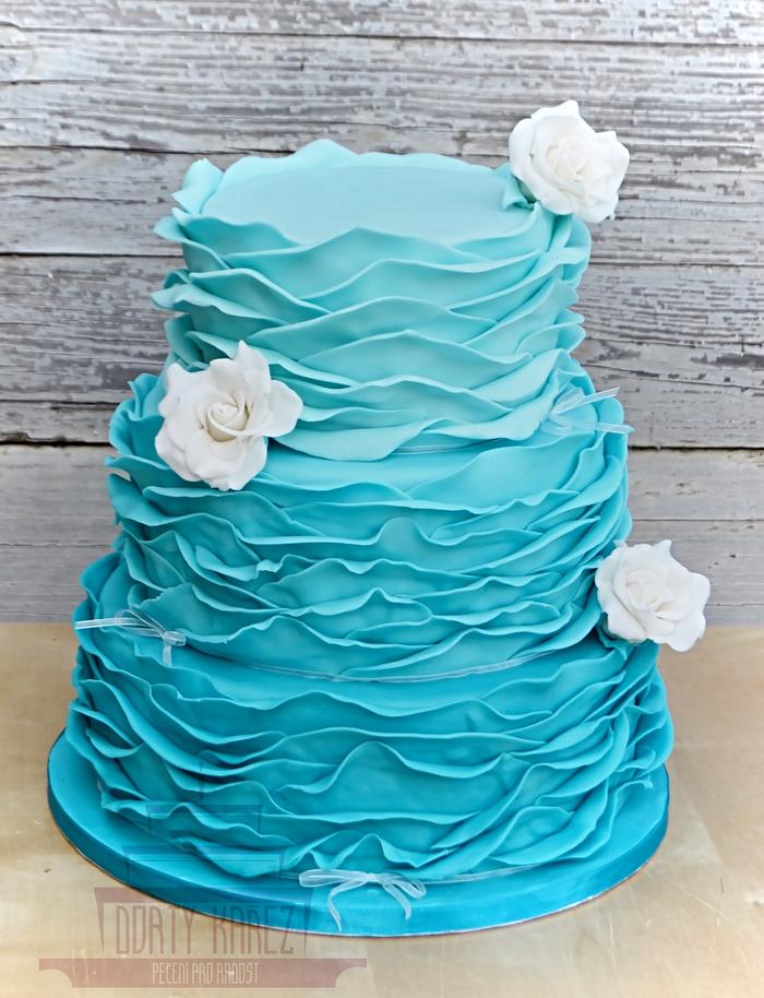 Turquoise wedding cake with white roses