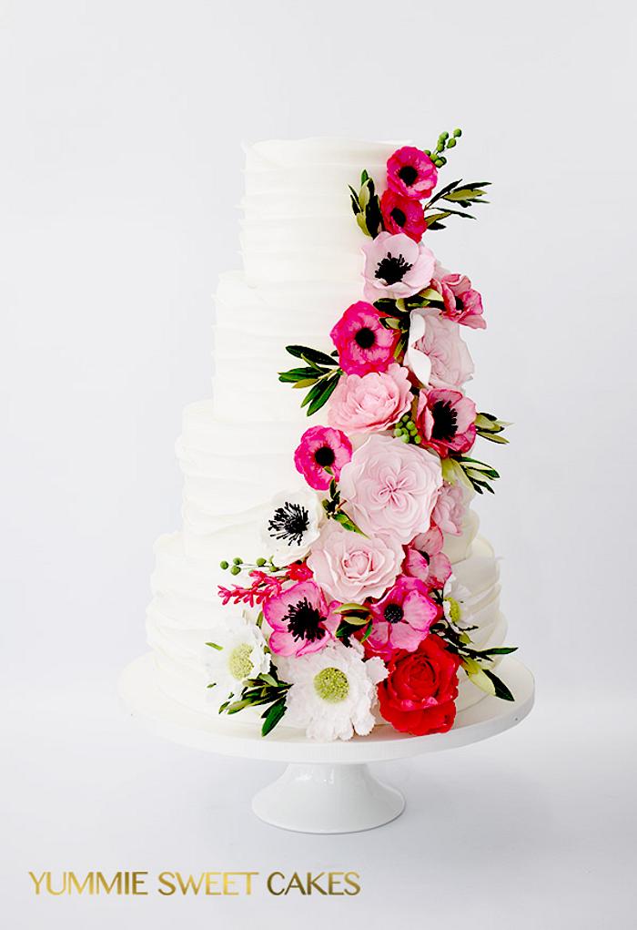 Wedding cake with a lot of flowers
