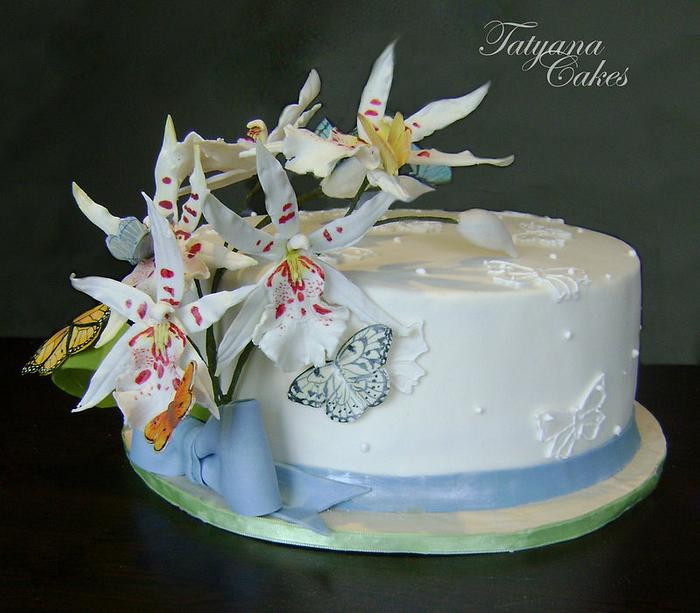 cake with orchids and butterflies