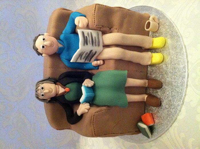 Couple on sofa anniversary cake