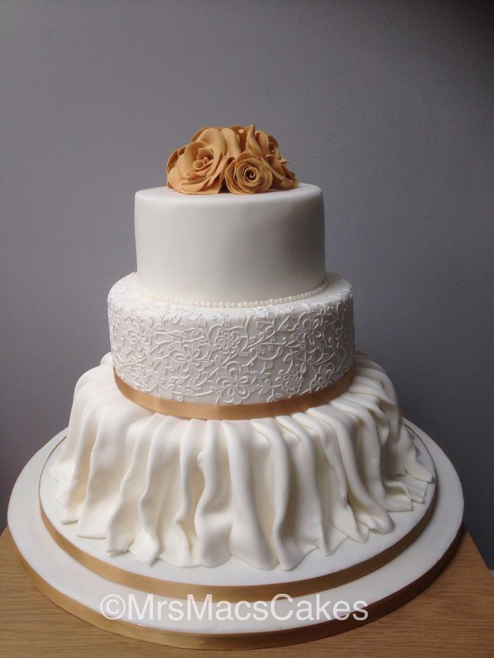 Skirted gold rose wedding cake