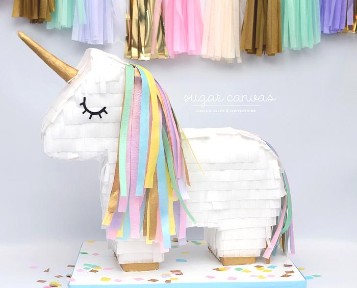 Unicorn piñata cake!