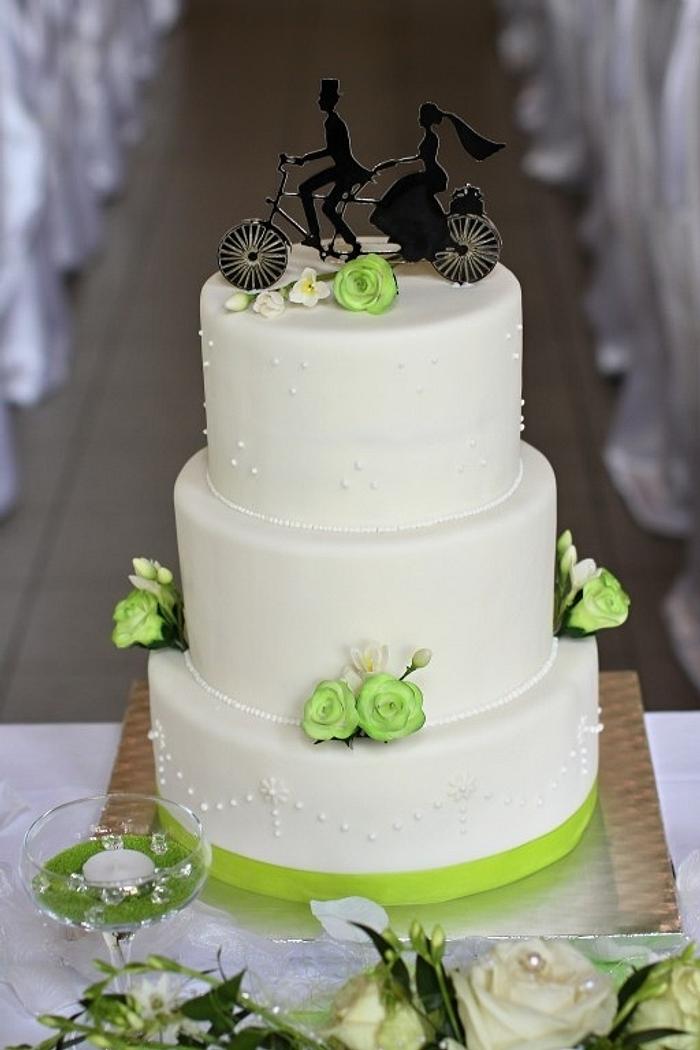 Wedding cake with cycling couple