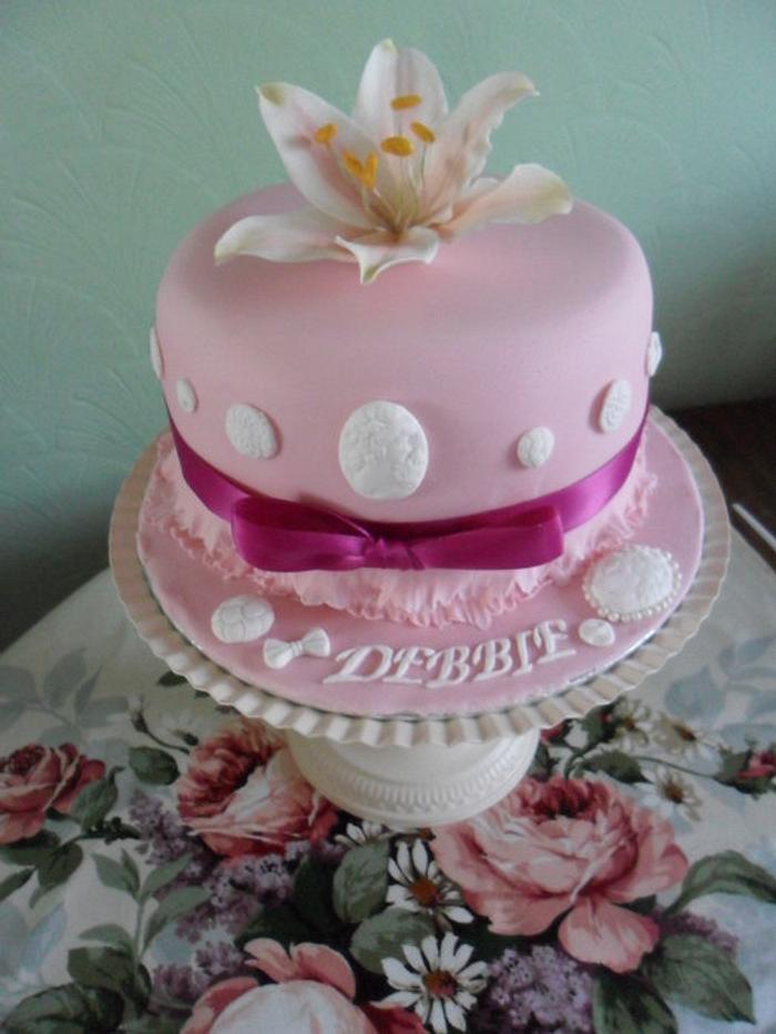 fantasy lily cake with vintage buttons and frills.