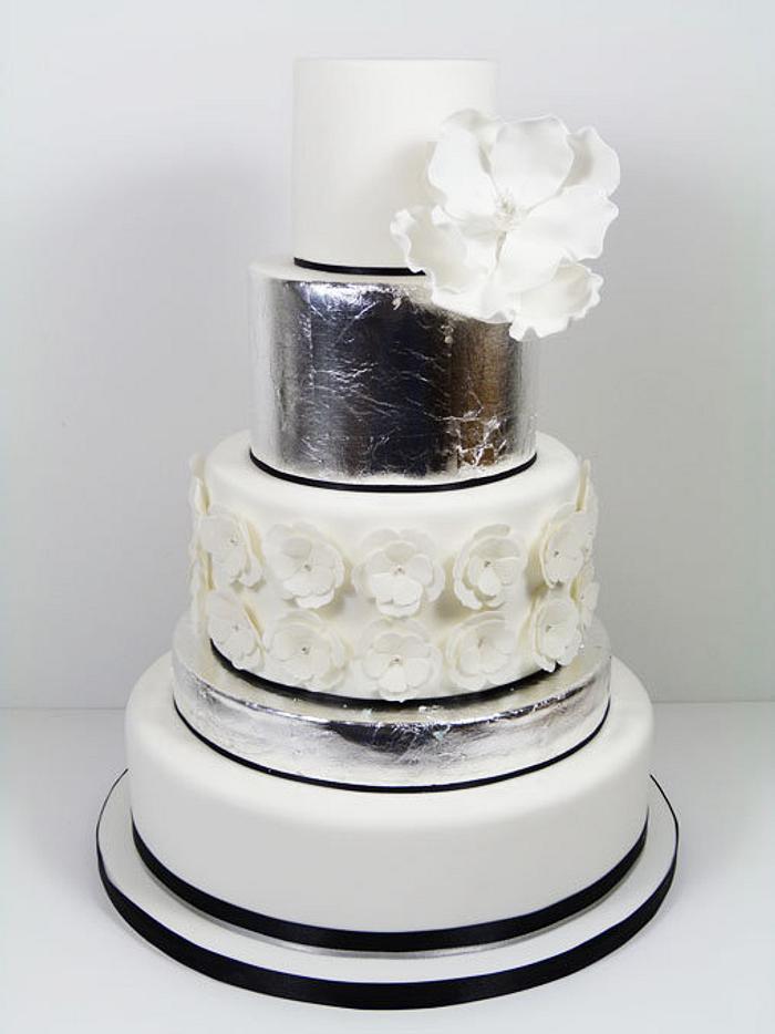 Silver leaf and magnolia wedding cake