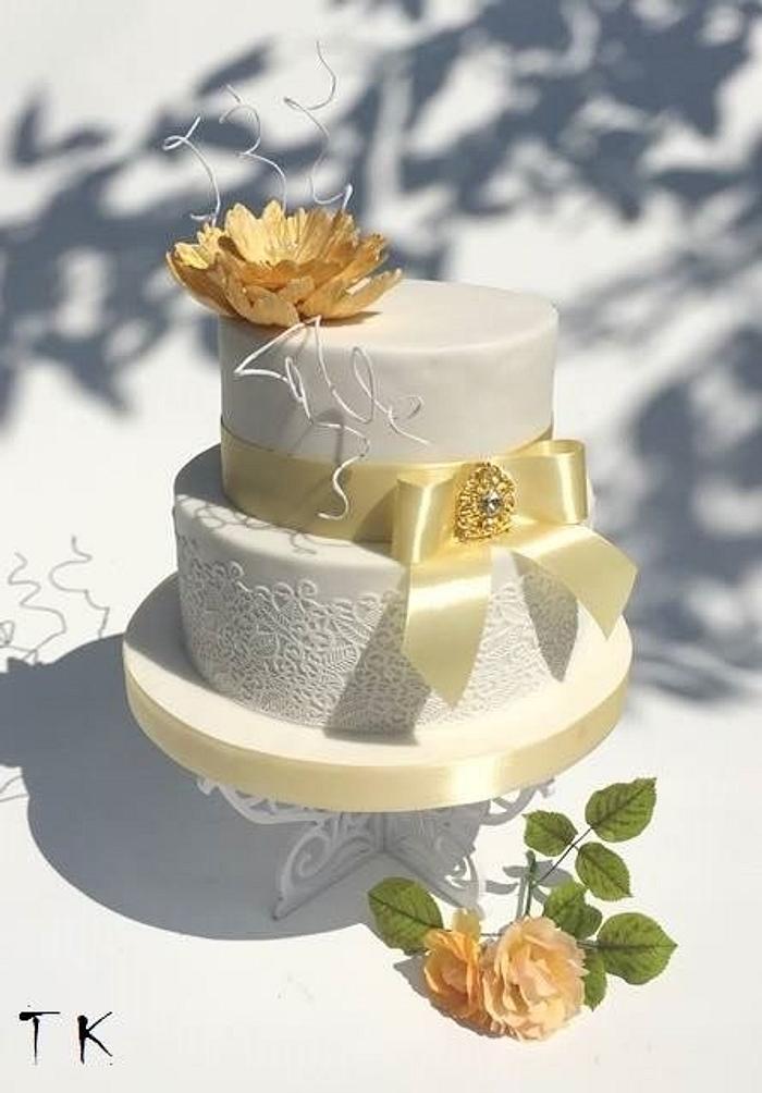 wedding cake with gold flower