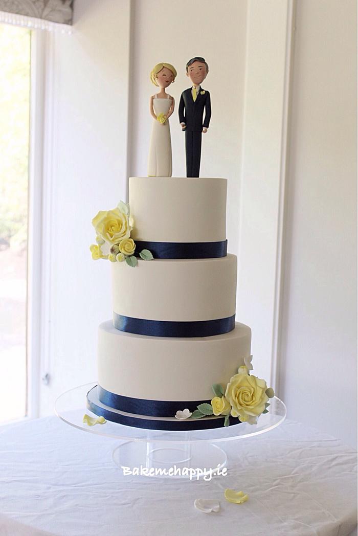 Yellow and navy themed wedding cake