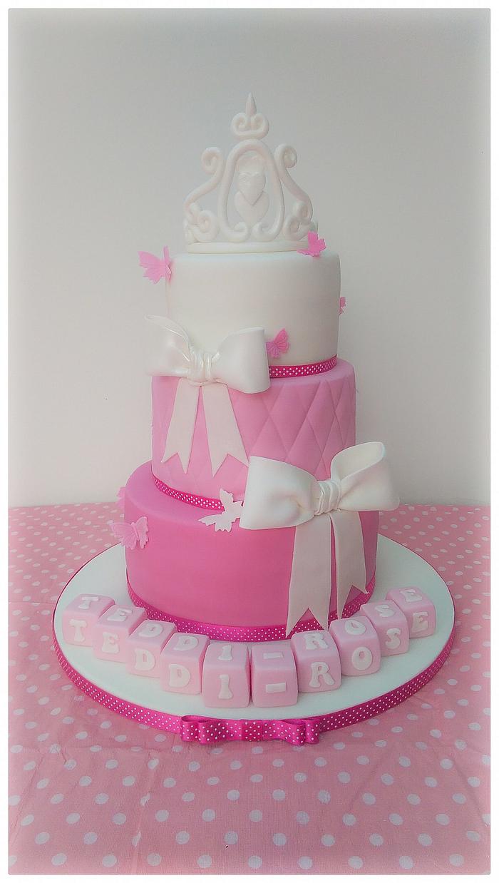 Pink tiara cake with bows.