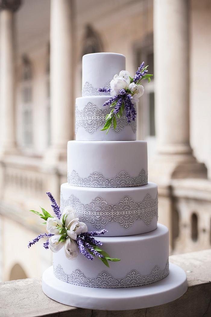 Wedding cake with lace , lavender and tulips