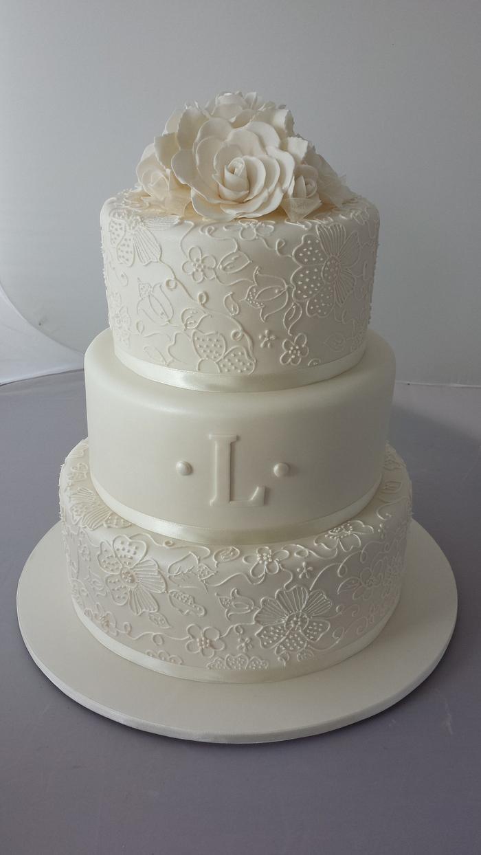 3 teir wedding cake with free hand piping.