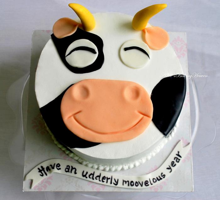 Simple fresh cream cow themed cake with fondant accents!!
