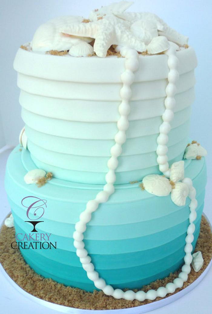 Beachy Ombre Wedding cake with Pearls and shells