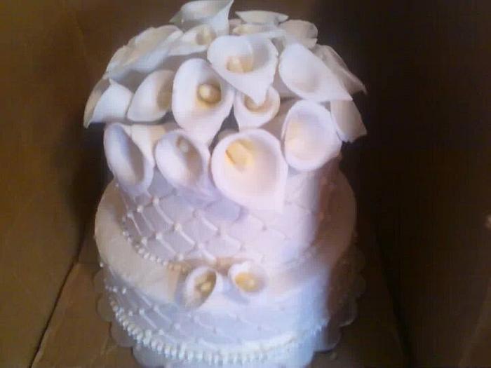 Wedding cake with calle lilly topper