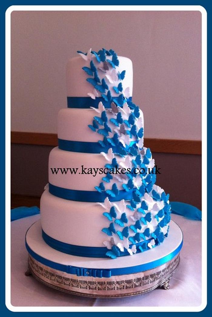Deep Turquoise & White Butterfly Cascade Wedding Cake