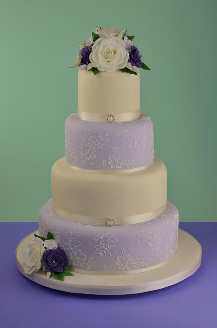 Lilac and Ivory piped lace and sugar flowers wedding cake.