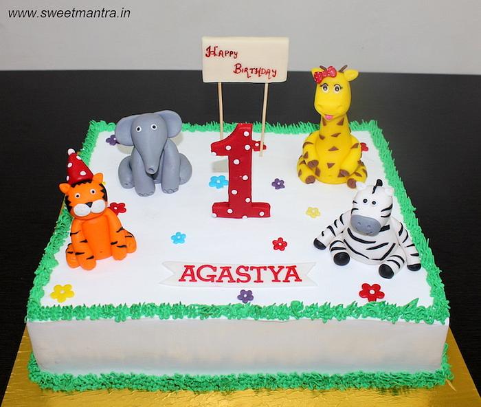 Animals theme fresh cream cake for 1st birthday - - CakesDecor