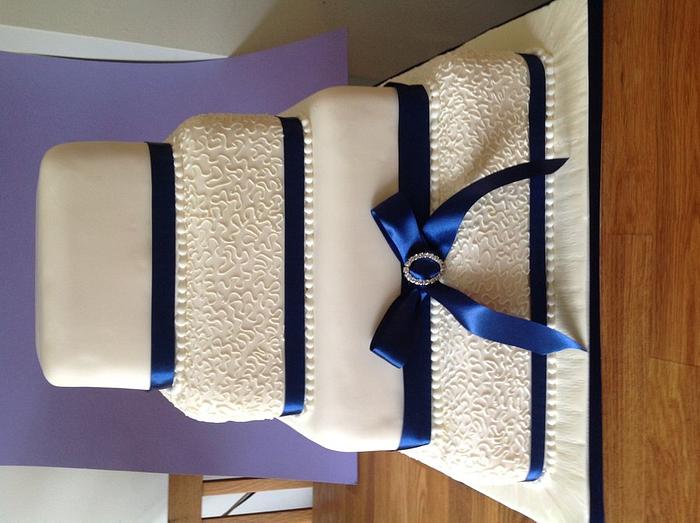 Navy and ivory wedding cake