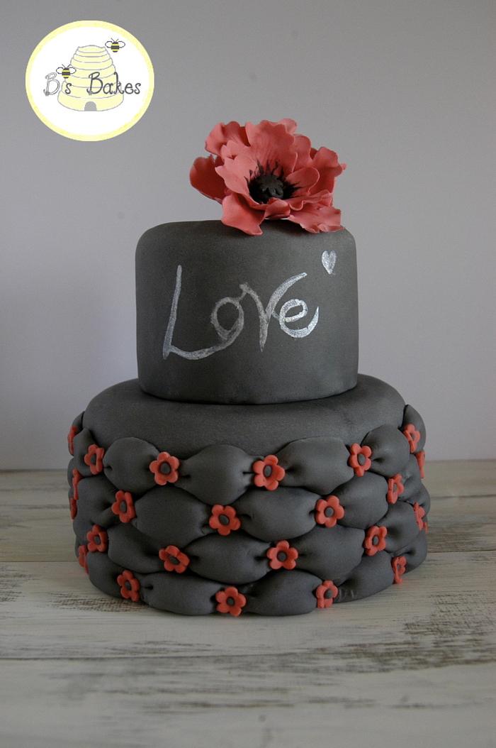 Black billowed cake with red accents