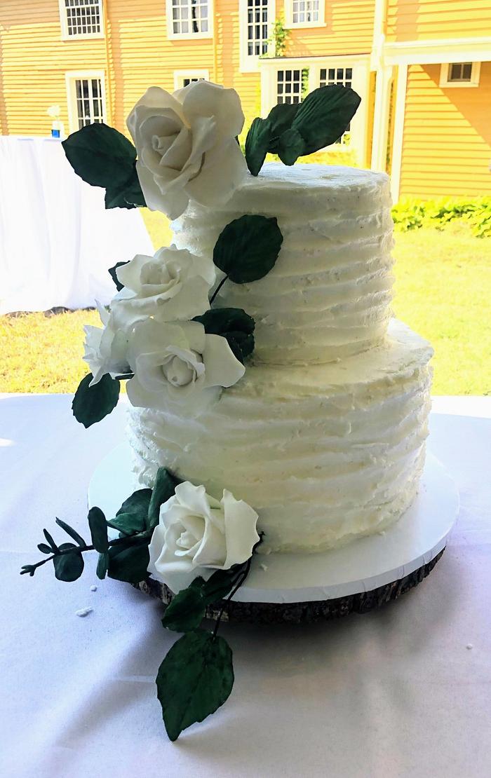 Rustic wedding cake with sugar roses