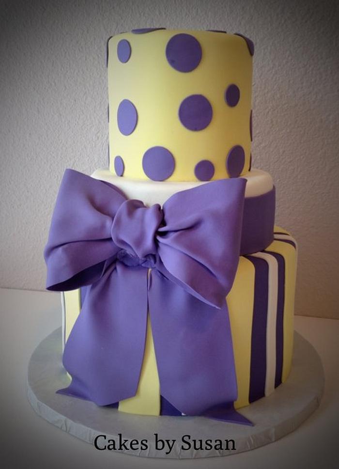 Purple and yellow baby shower cake