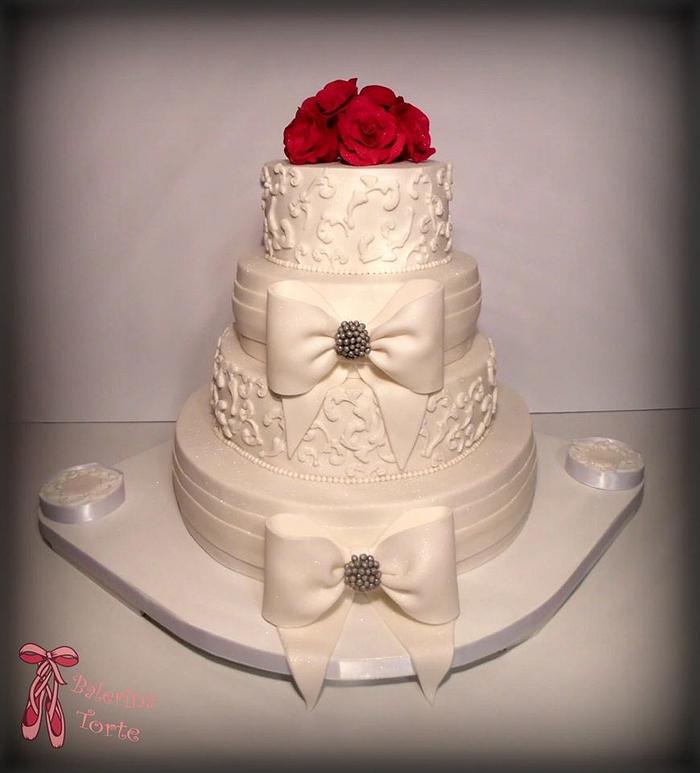 White Wedding Cake with Red Roses