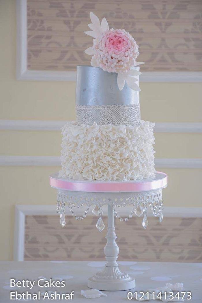Silver ruffled wedding cake 