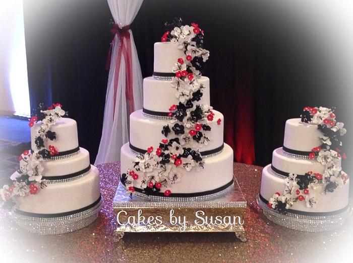 Black, red, and white wedding cake