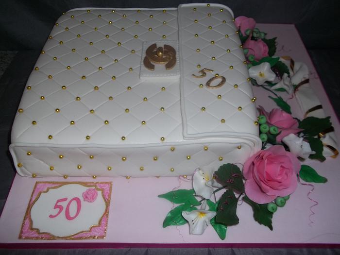 Chanel swag for 50th birthday - Decorated Cake by Willene - CakesDecor