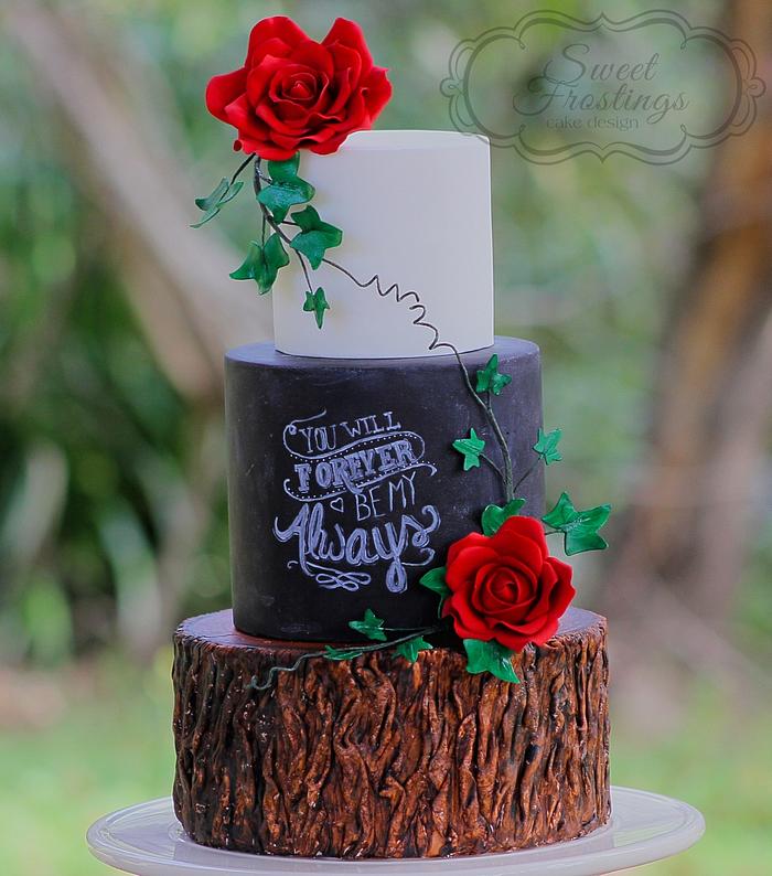 Rustic chalkboard and tree stump wedding cake