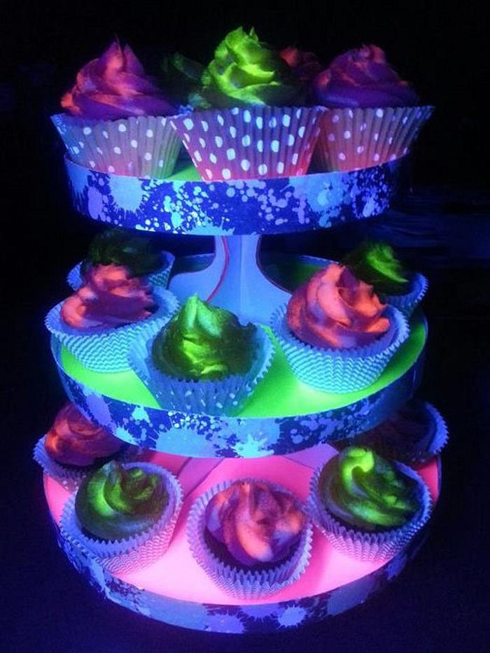 Black light glowing cupcakes and stand