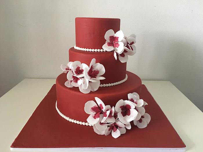 Red cake and wafer paper flowers