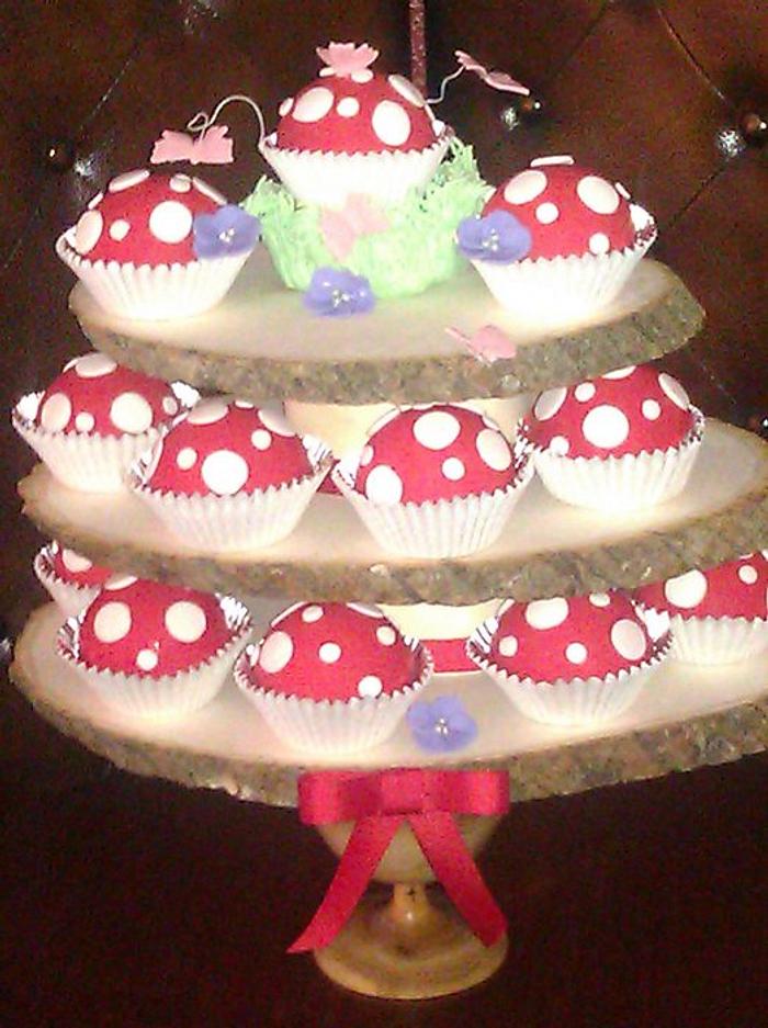 Toadstool cup cakes on tree stand