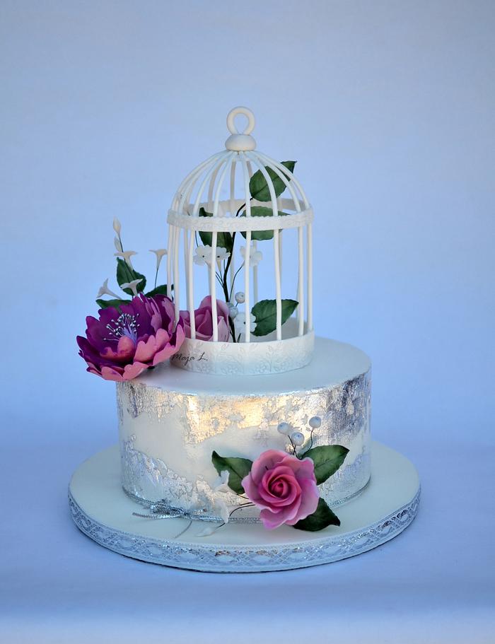 wedding cake with edible silver leaf and bird cage